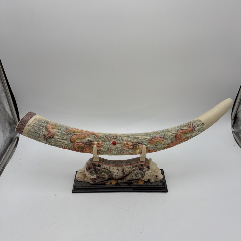 decorative Asian-style carved tusk-form sculpture featuring two dragons